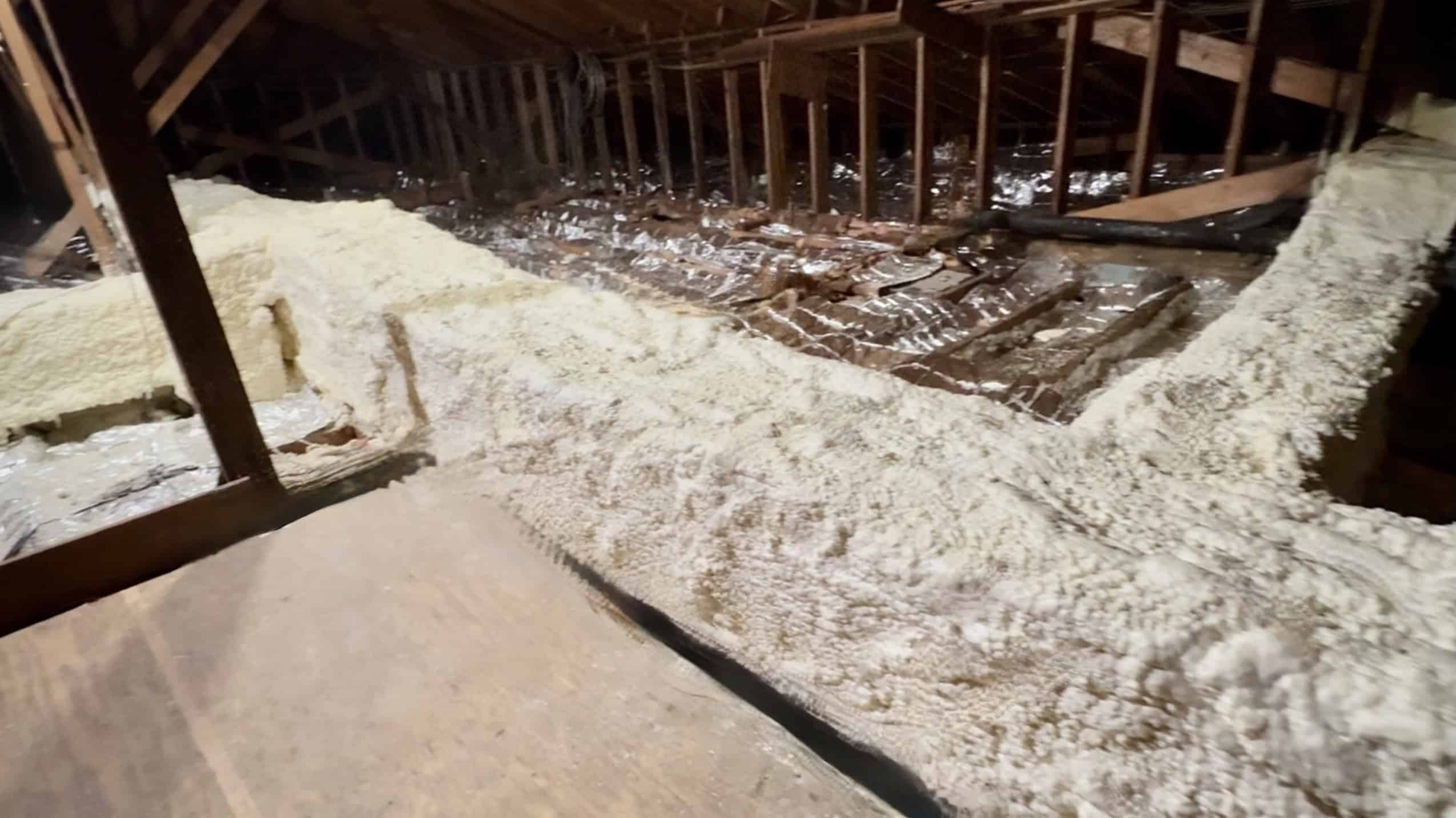 Attic Ductwork Spray Foam Insulation: Stop Wasting Energy on Failing Fiberglass 1 Inside an attic in Louisiana with rigid metal ductwork insulated with spray foam insulation.