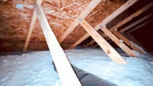 Loose-fill fiberglass insulation blown into a home's attic.