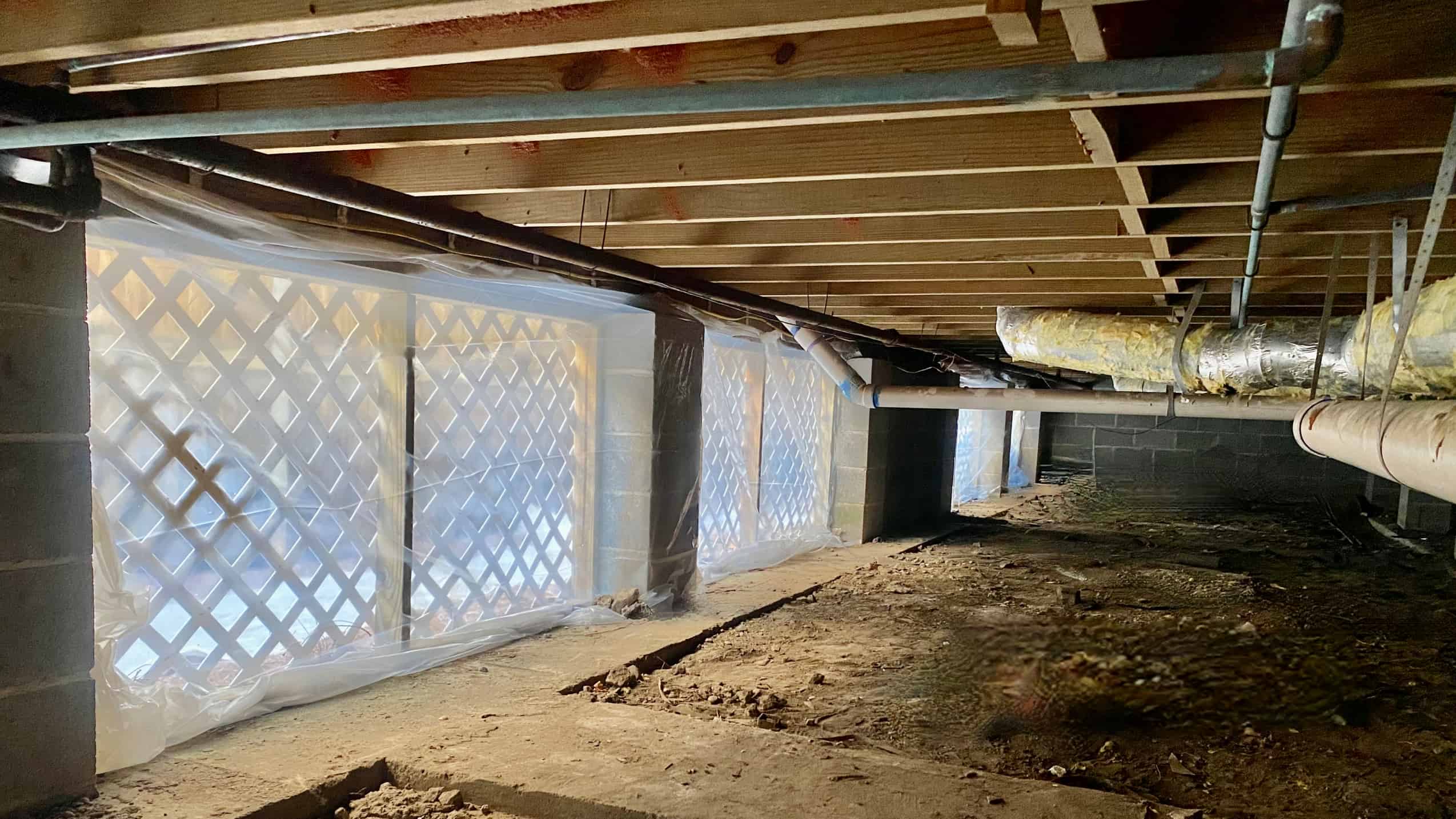 Raised home with metal ductwork previously wrapped with fiberglass insulation. Raised home with metal ductwork previously wrapped with fiberglass insulation.