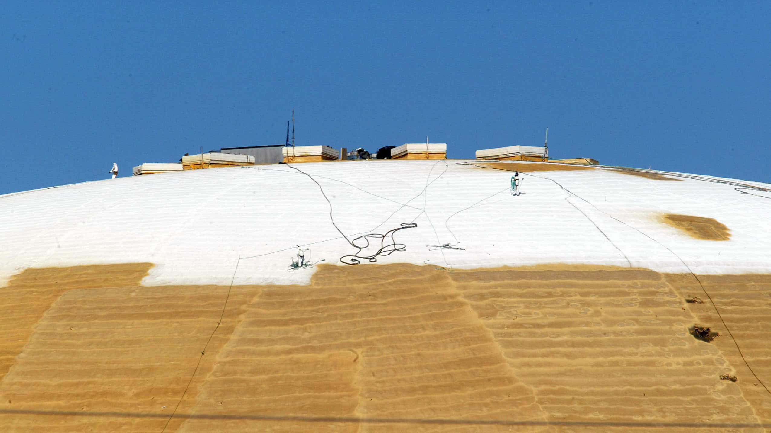 FEMA & Closed Cell Spray Foam - Image: New Orleans Superdome having closed cell spray foam installed on the roof to repair it after Hurricane Katrina.